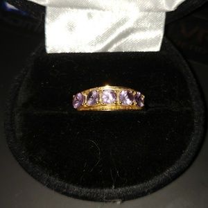 14kt yellow gold band with purple tanzanite